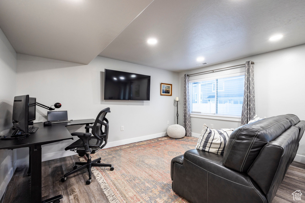 Home office featuring hardwood / wood-style floors