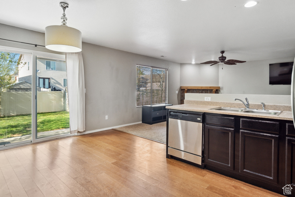 Kitchen featuring light hardwood / wood-style flooring, sink, dishwasher, and plenty of natural light
