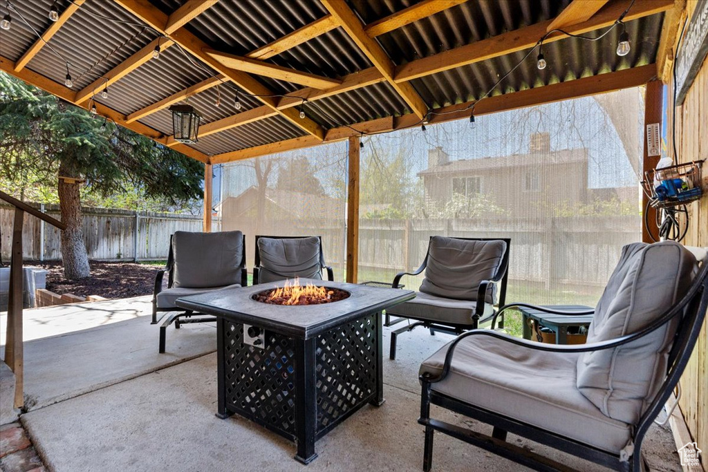View of terrace with an outdoor fire pit