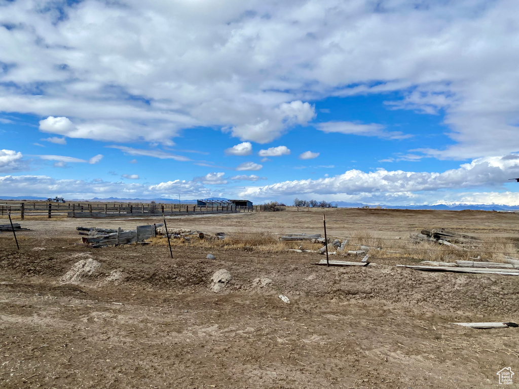 View of yard with a rural view