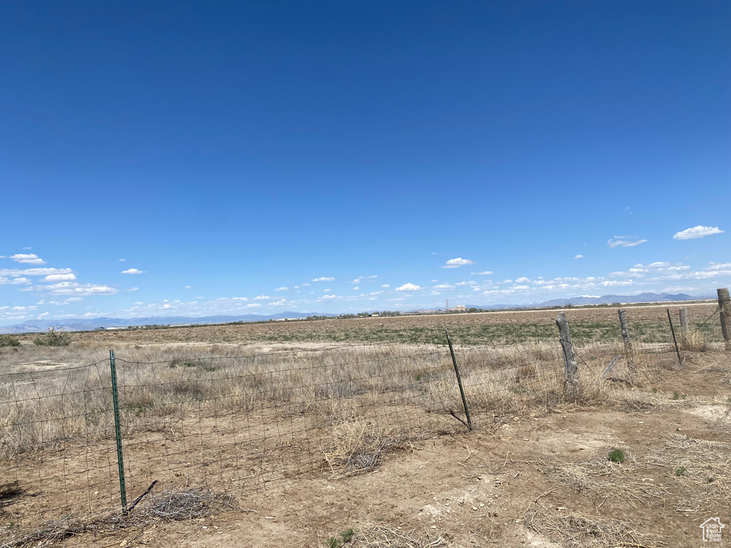 View of yard with a rural view