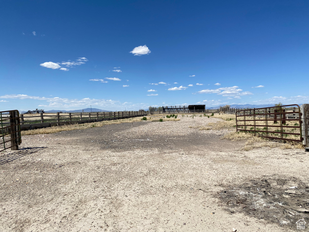 View of yard with a rural view