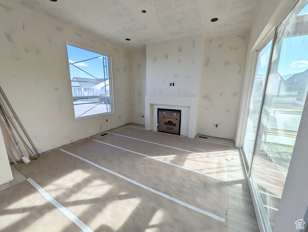 Unfurnished living room featuring a fireplace