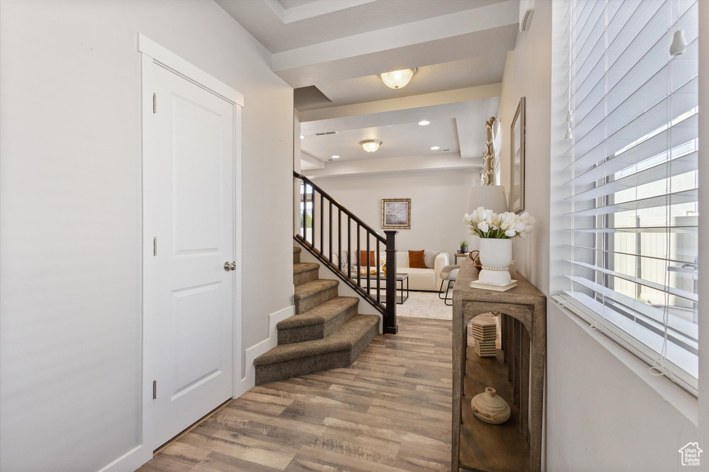 Entryway with hardwood / wood-style flooring