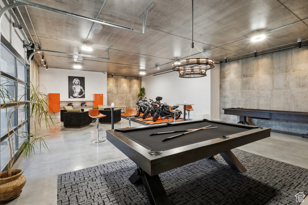 Rec room featuring billiards and concrete floors