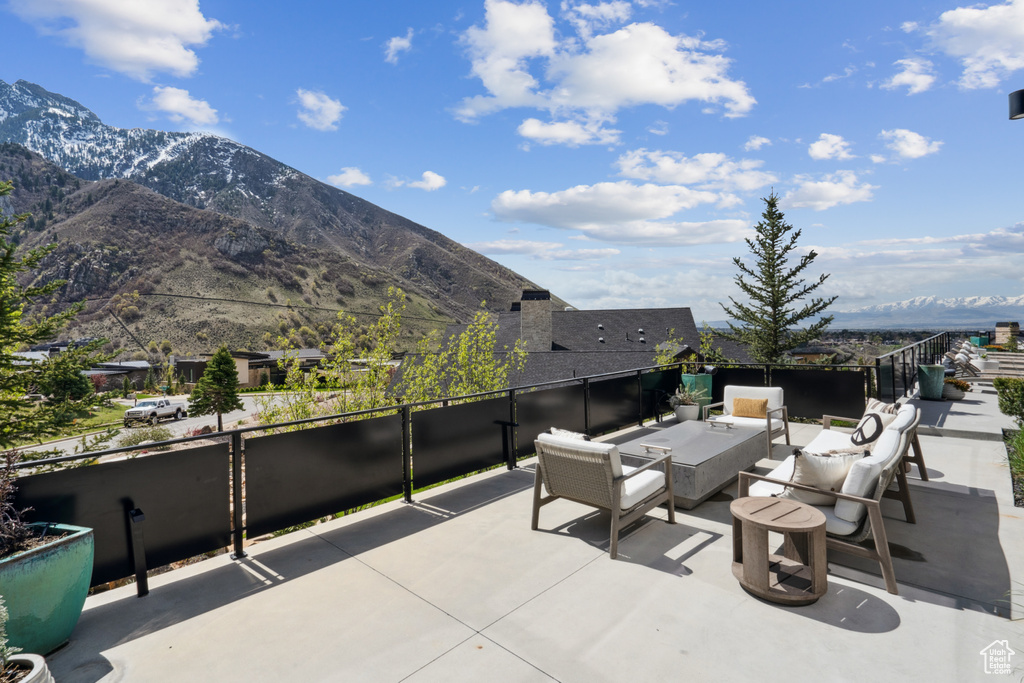 View of terrace with a mountain view, a balcony, and outdoor lounge area