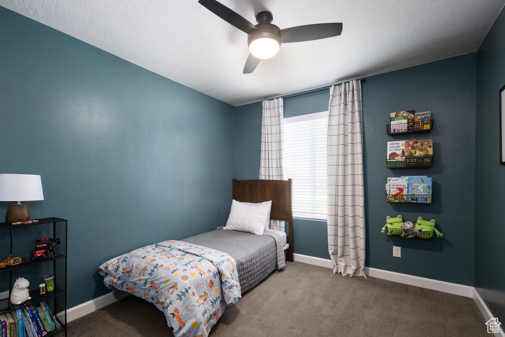 Bedroom with carpet flooring and ceiling fan