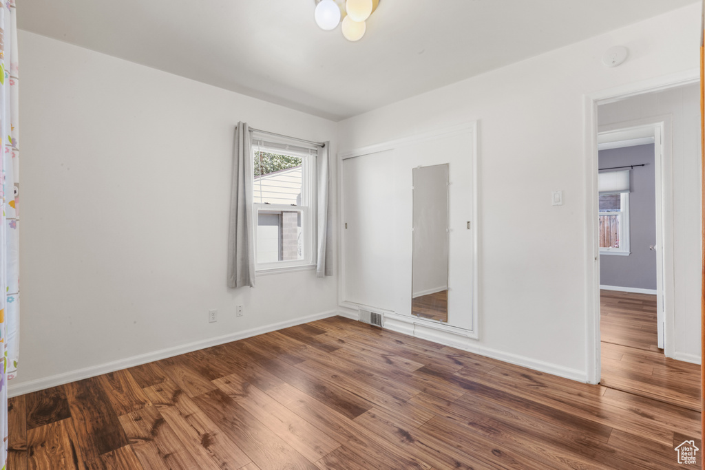 Unfurnished room featuring hardwood / wood-style floors