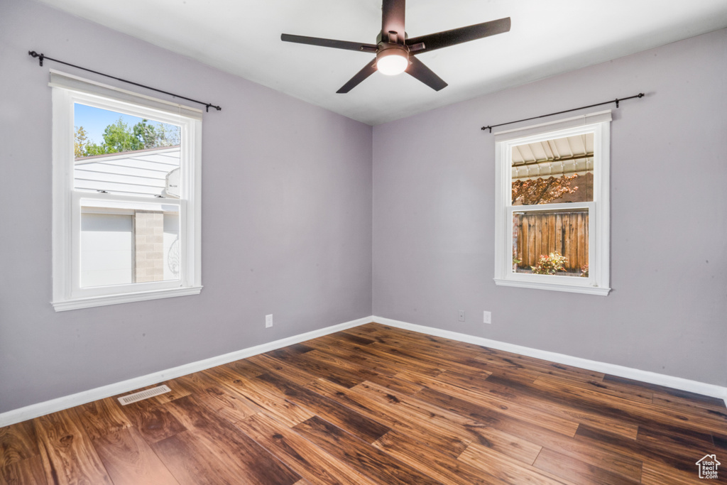 Spare room with ceiling fan and hardwood / wood-style floors