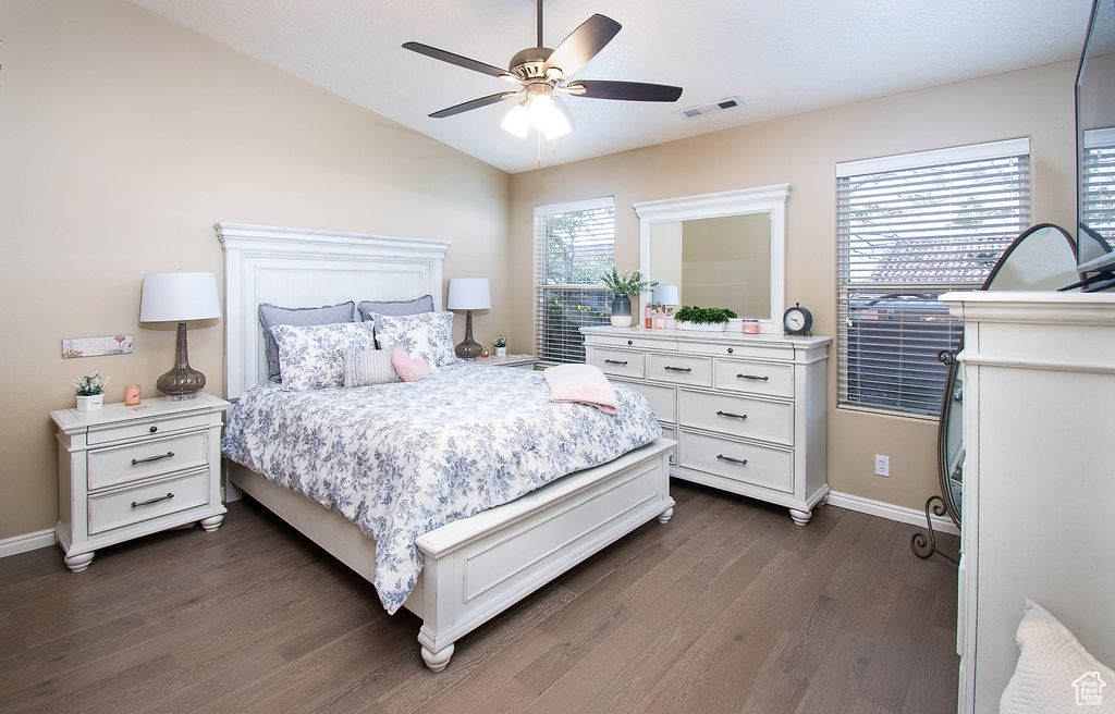 Bedroom featuring lofted ceiling, ceiling fan, and dark hardwood / wood-style floors