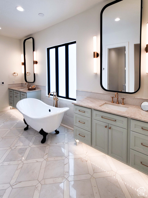 Bathroom featuring vanity and a bathtub