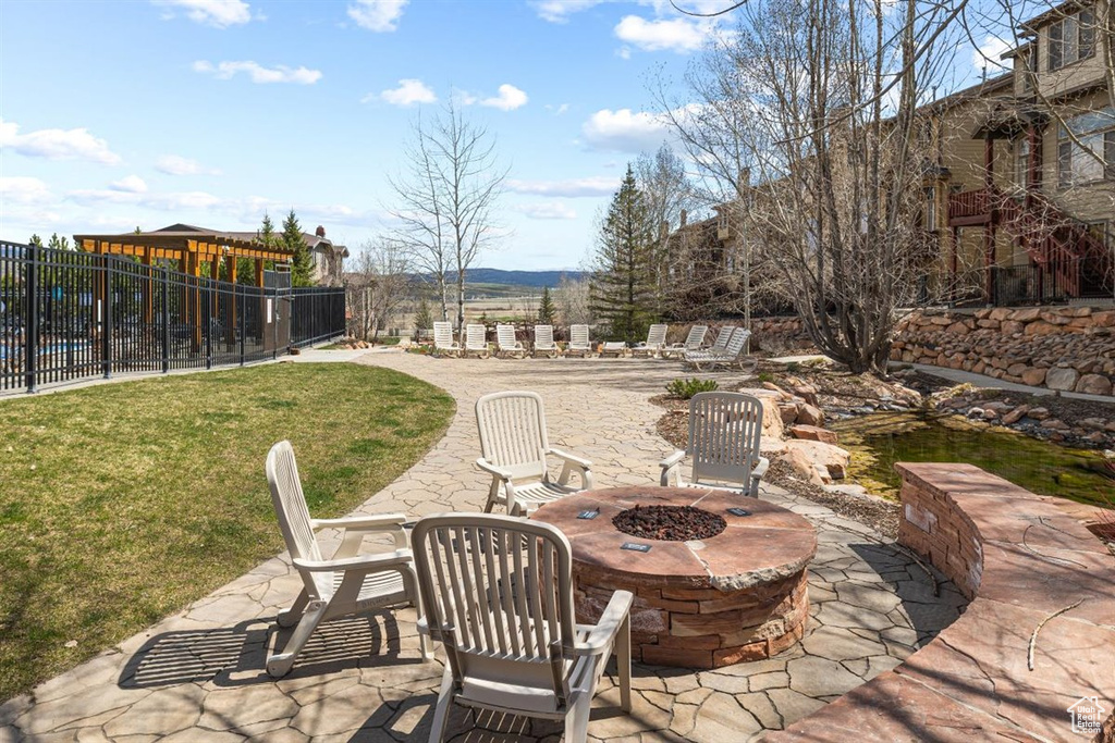 View of patio / terrace with a fire pit