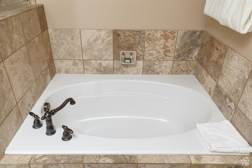 Bathroom with tiled bath