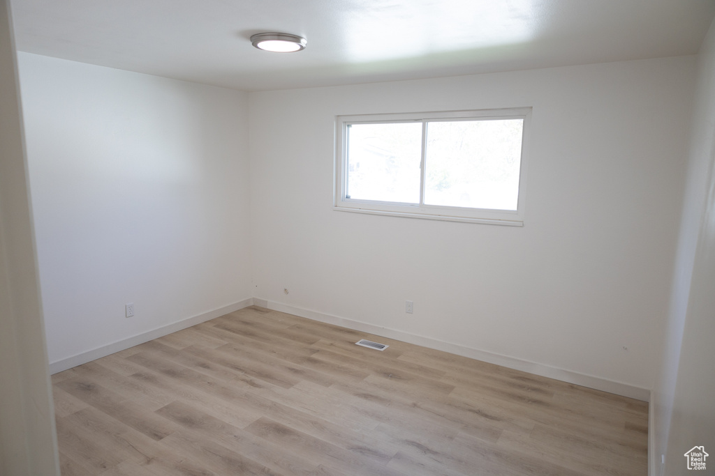 Spare room featuring light hardwood / wood-style flooring