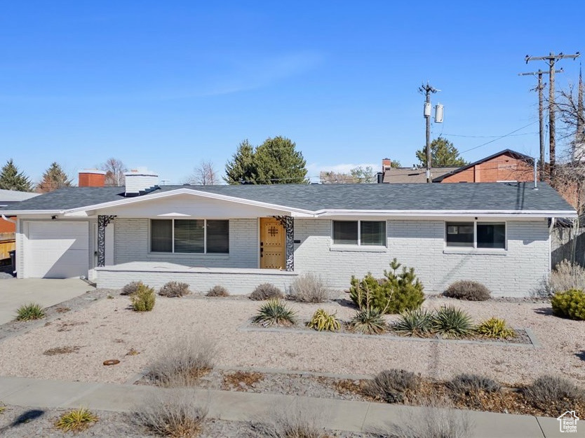 Single story home featuring a garage