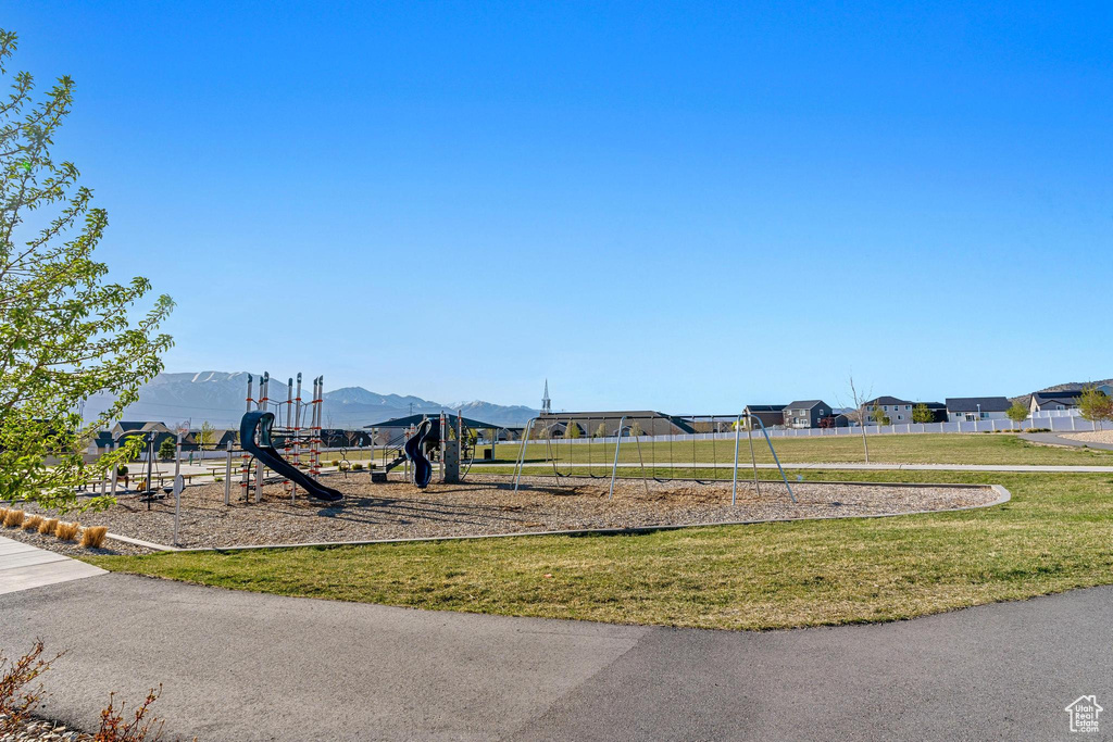 View of nearby features featuring a yard and a playground