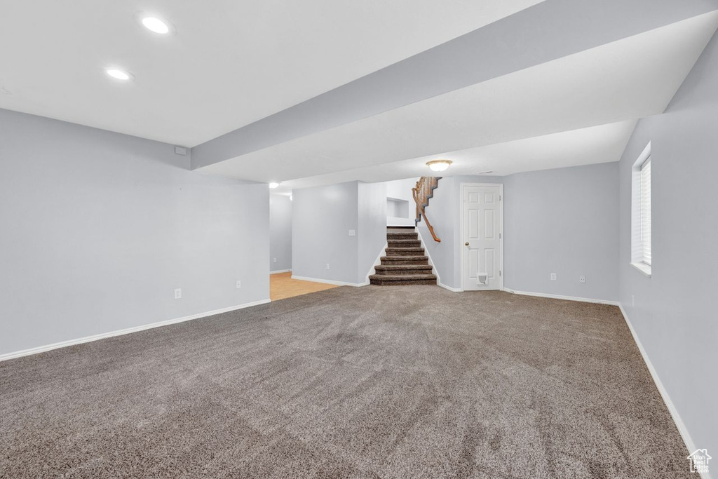 Basement featuring carpet flooring