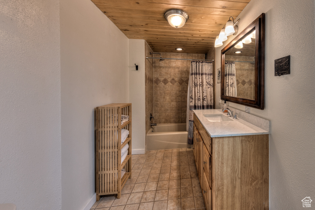 Bathroom with tile flooring, radiator heating unit, large vanity, shower / tub combo with curtain, and wooden ceiling