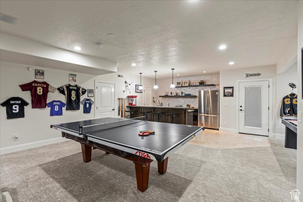Game room with light tile floors