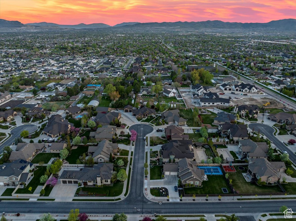 Aerial view at dusk featuring a mountain view