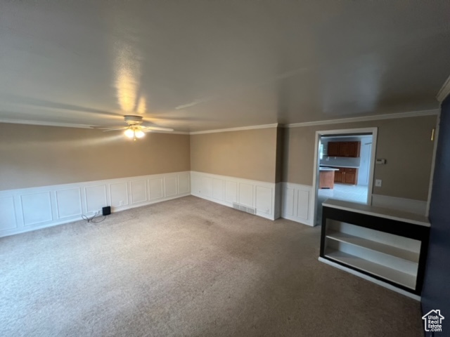 Unfurnished room with crown molding and ceiling fan