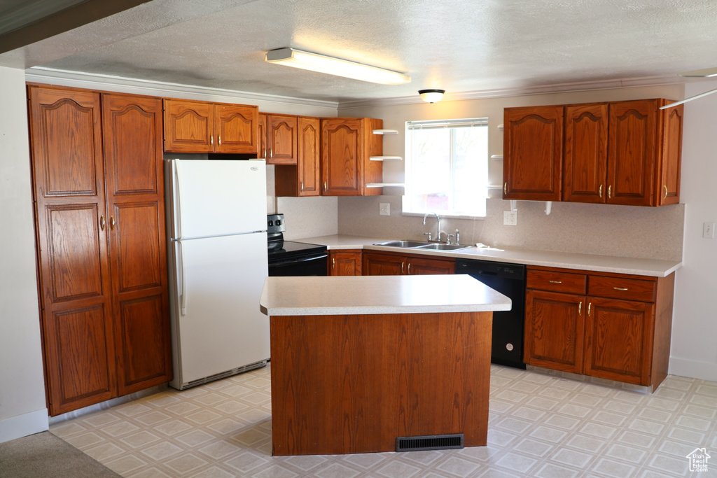 Kitchen with dishwasher, electric range, sink, white refrigerator, and light tile floors