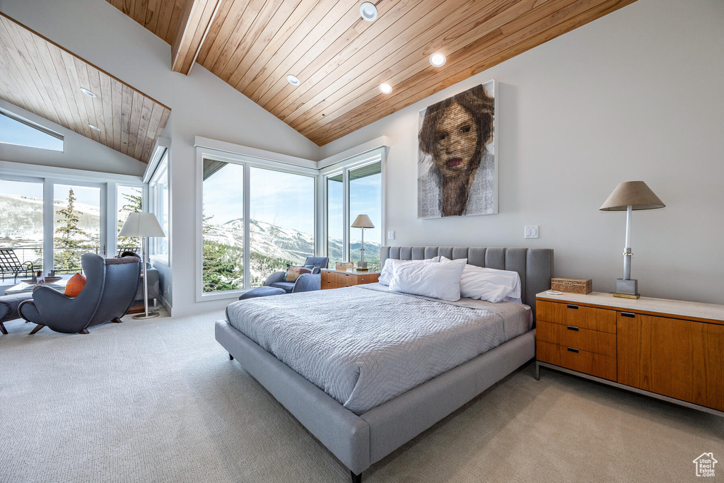 Carpeted bedroom featuring wooden ceiling, high vaulted ceiling, beamed ceiling, and multiple windows