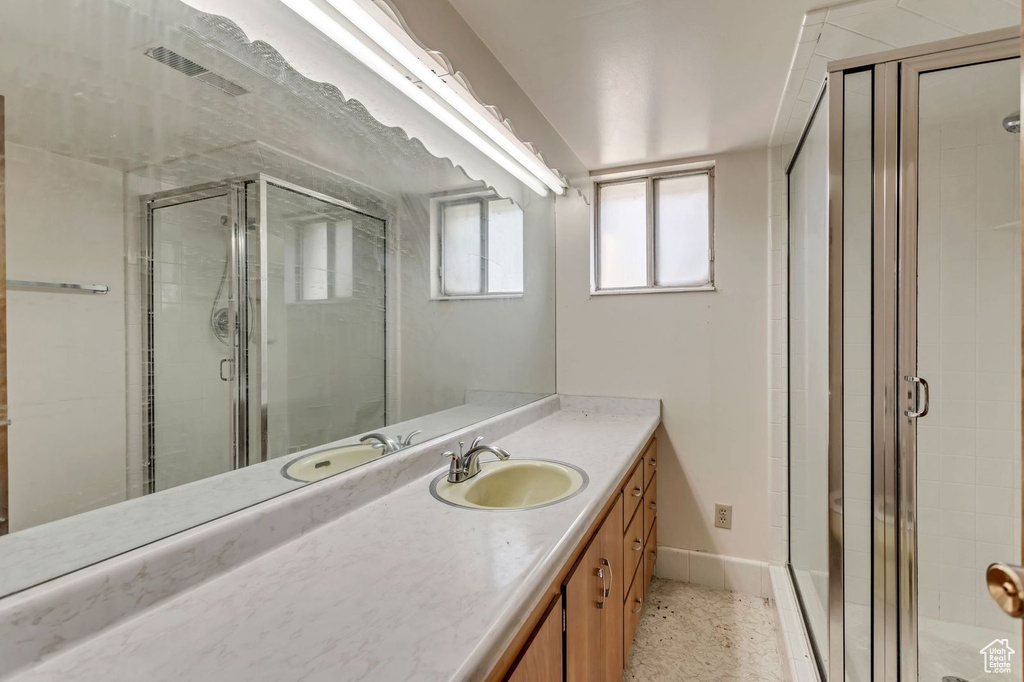 Bathroom with walk in shower and large vanity