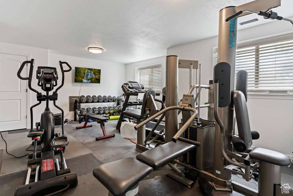 Exercise room featuring plenty of natural light