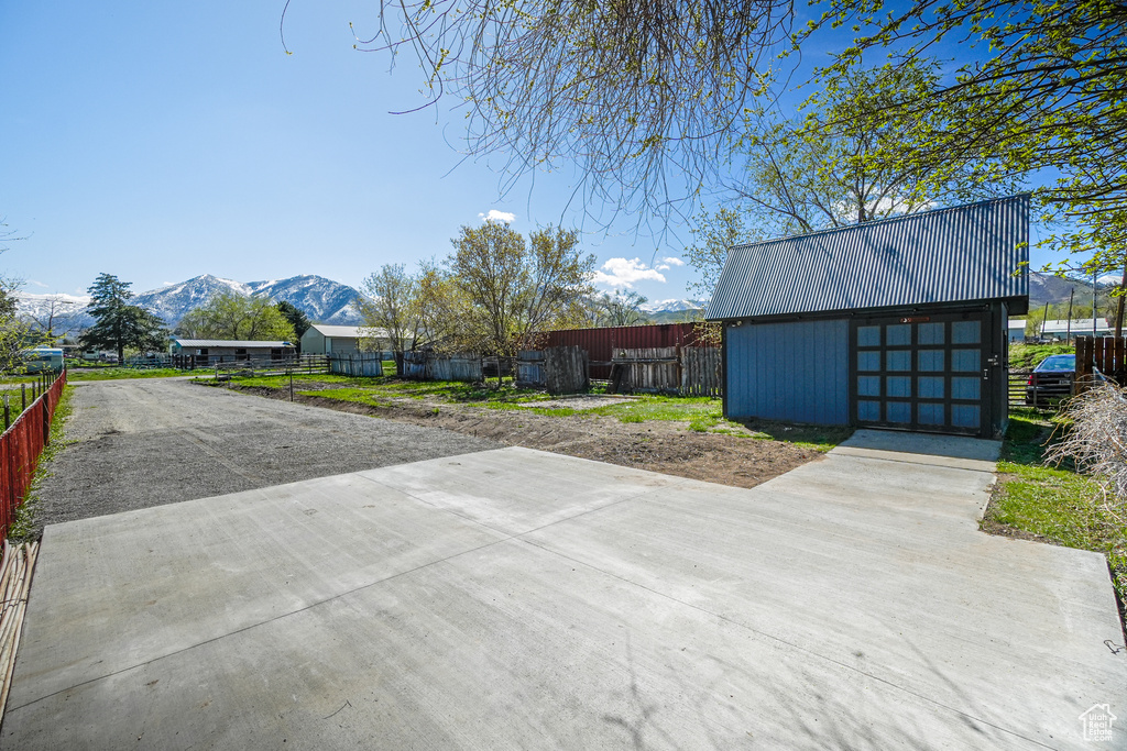 Exterior space with a mountain view and an outdoor structure