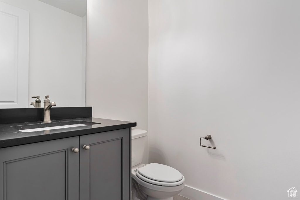 Bathroom with toilet and vanity