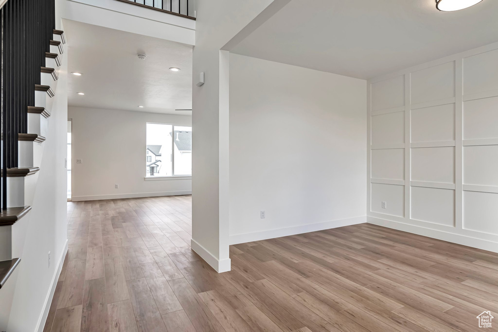 Empty room featuring hardwood / wood-style flooring