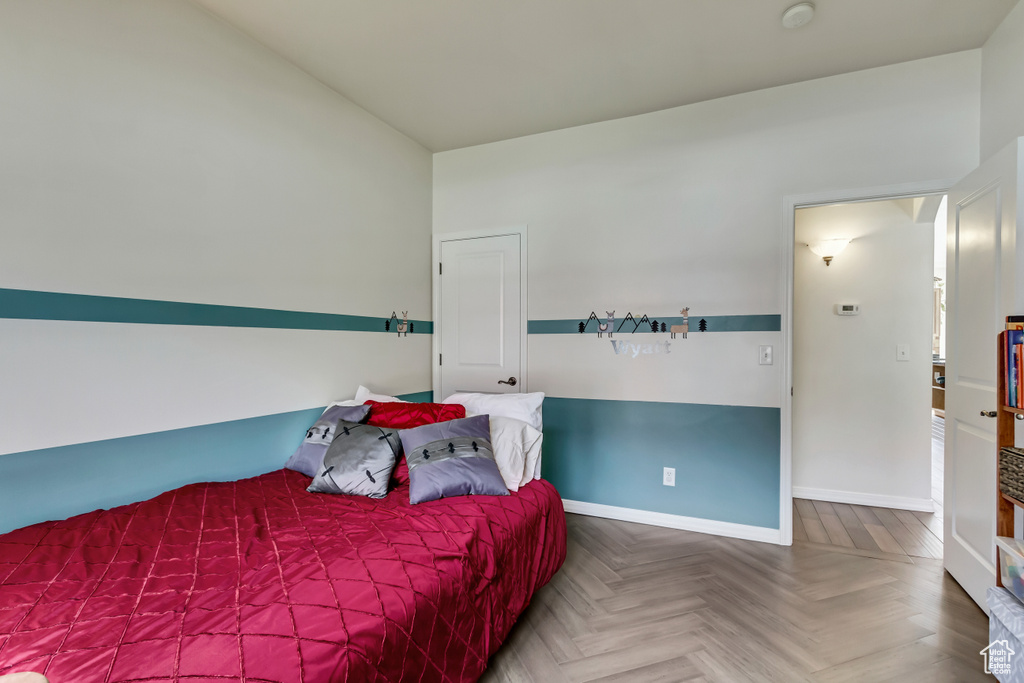 Bedroom featuring parquet floors