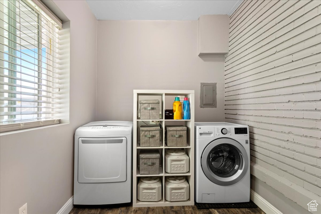 Laundry area featuring dark hardwood / wood-style flooring and separate washer and dryer