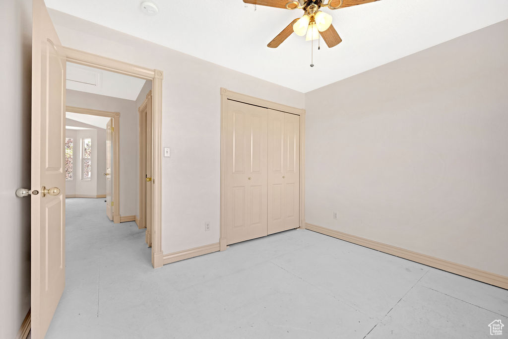 Unfurnished bedroom featuring a closet and ceiling fan