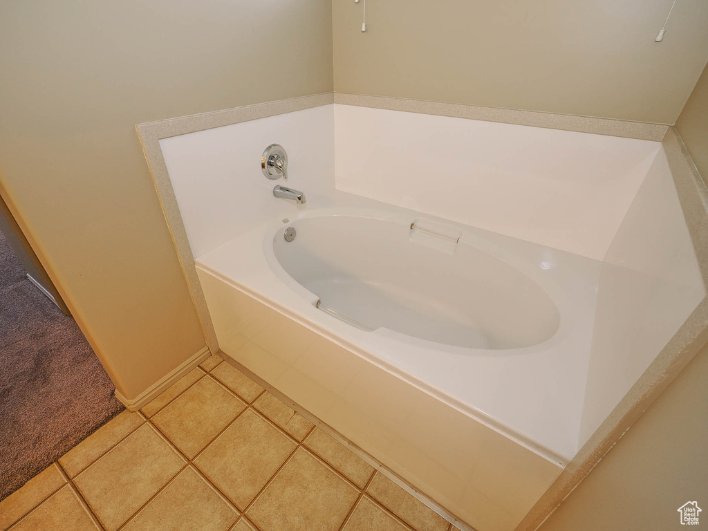 Bathroom featuring a bathing tub and tile floors