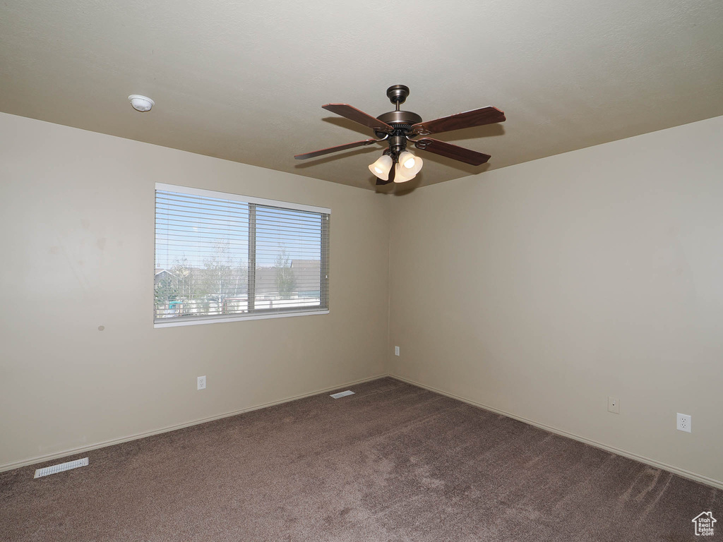 Unfurnished room with carpet floors and ceiling fan