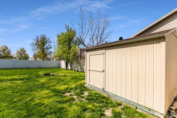 View of yard with a storage shed