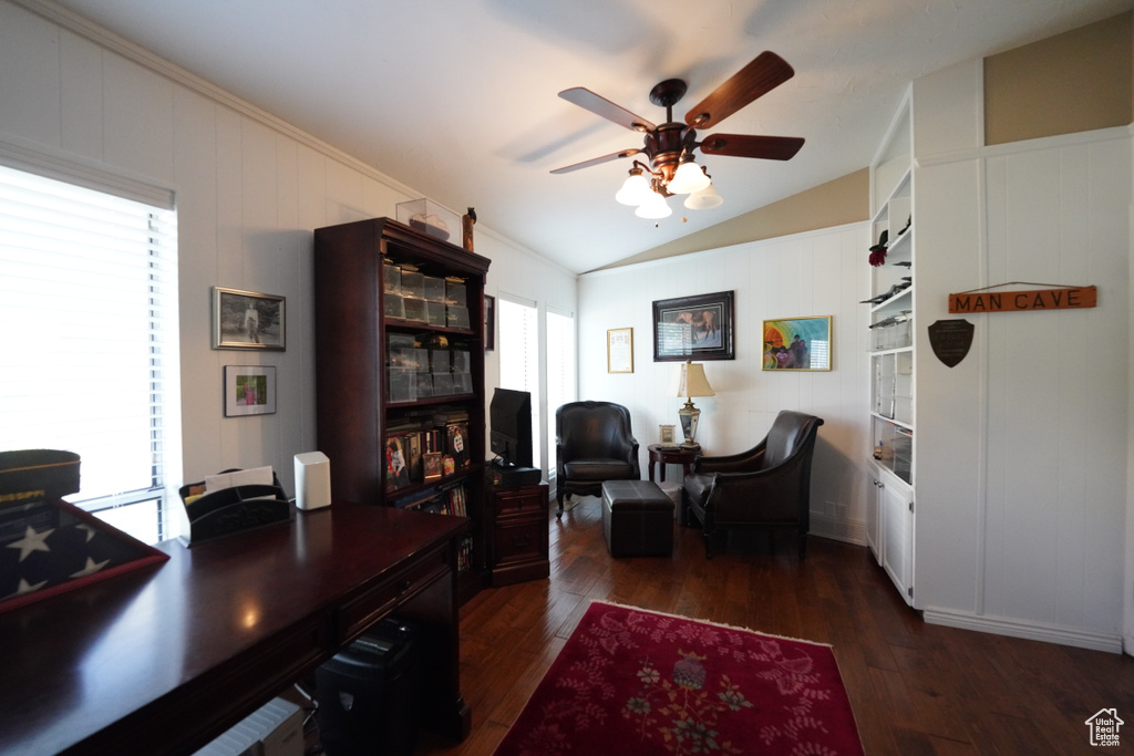 Office area with lofted ceiling, ceiling fan, and dark hardwood / wood-style floors