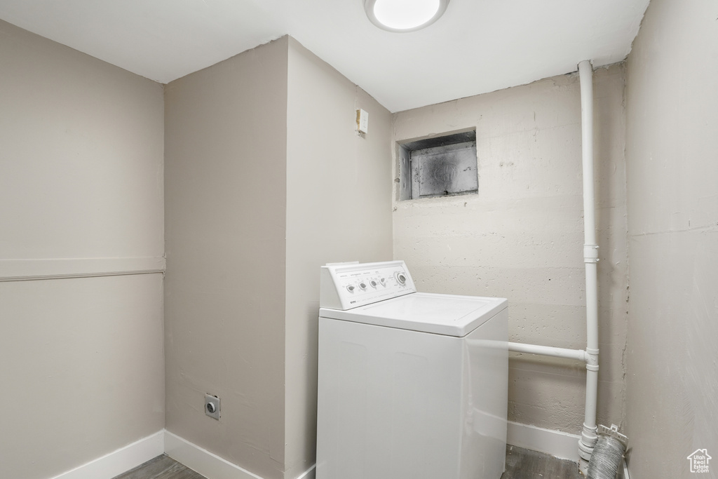 Laundry room featuring hardwood / wood-style flooring and washer / clothes dryer