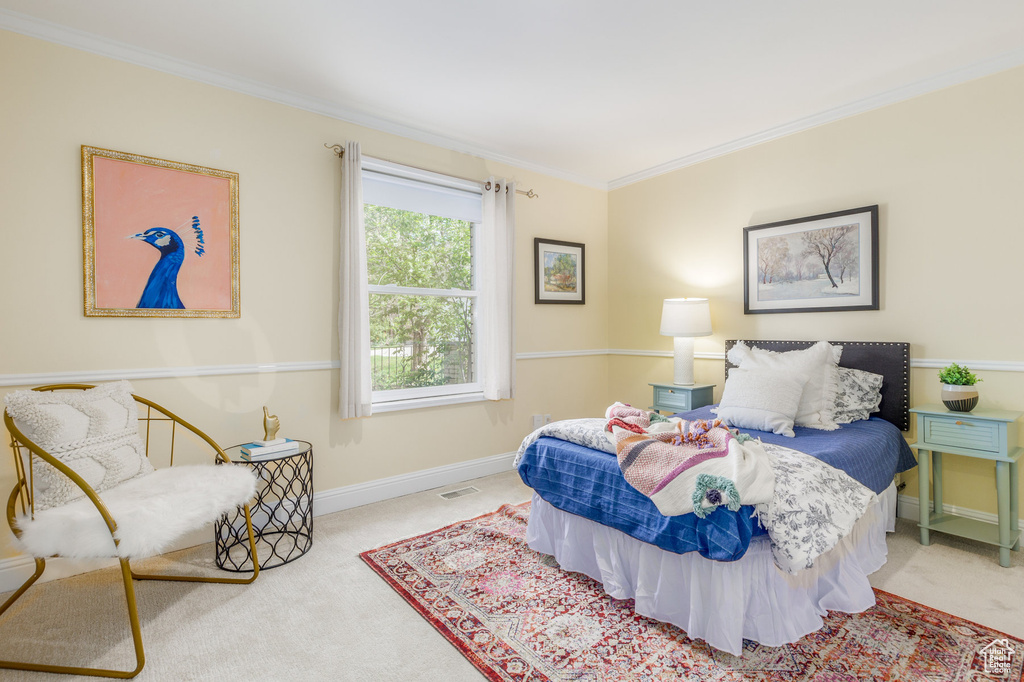 Bedroom with carpet floors and ornamental molding