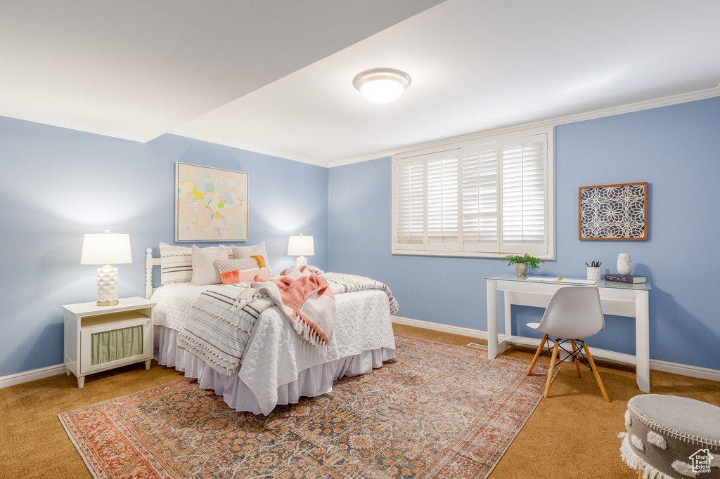 Bedroom featuring carpet and ornamental molding