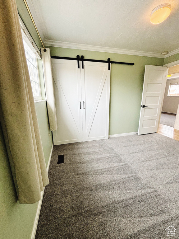 Unfurnished bedroom featuring carpet floors and ornamental molding