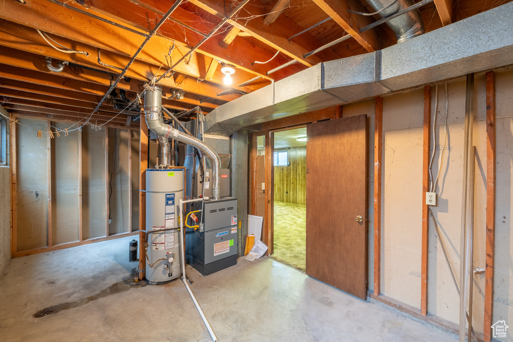 Basement featuring heating utilities and gas water heater