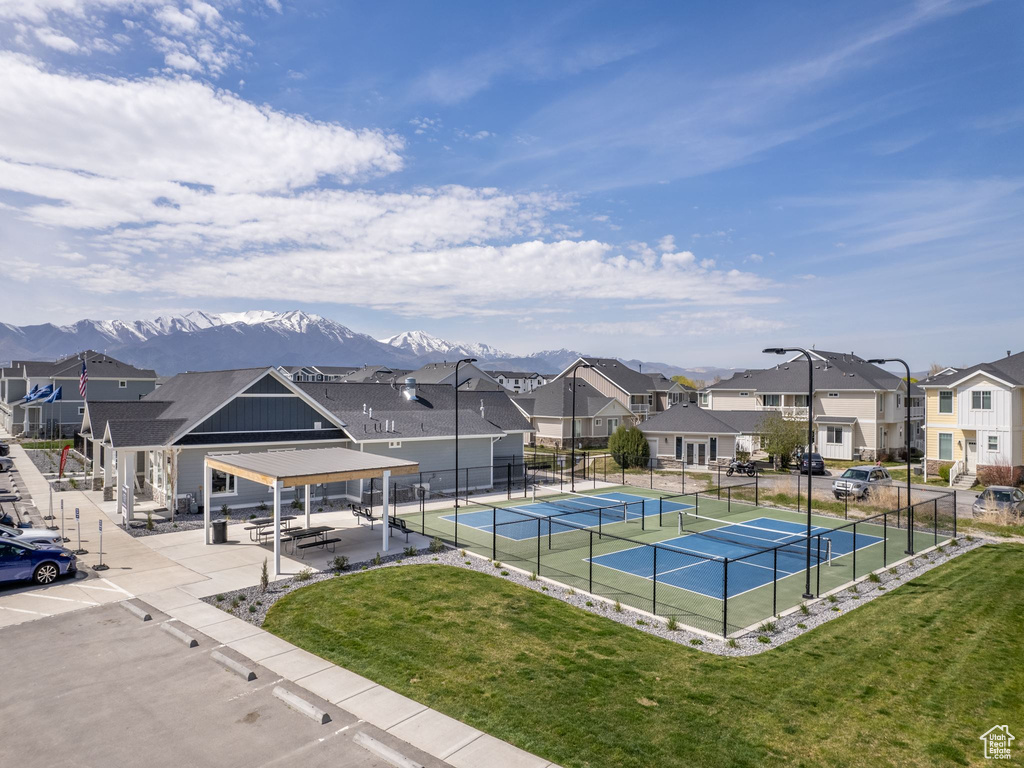 View of pool featuring tennis court, a mountain view, and a yard