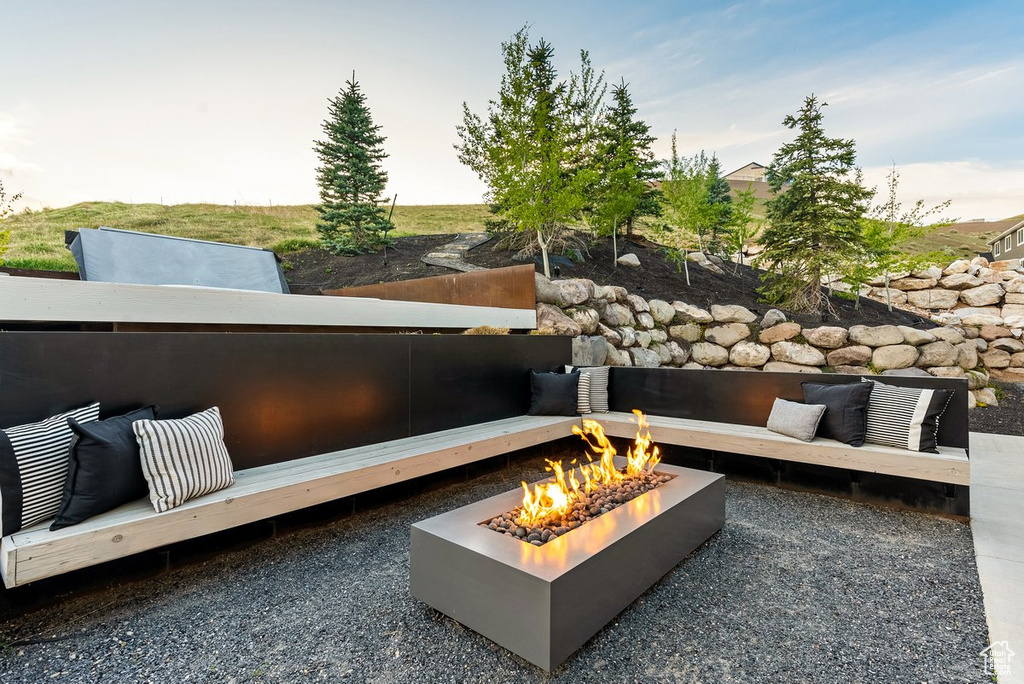 View of patio featuring an outdoor fire pit