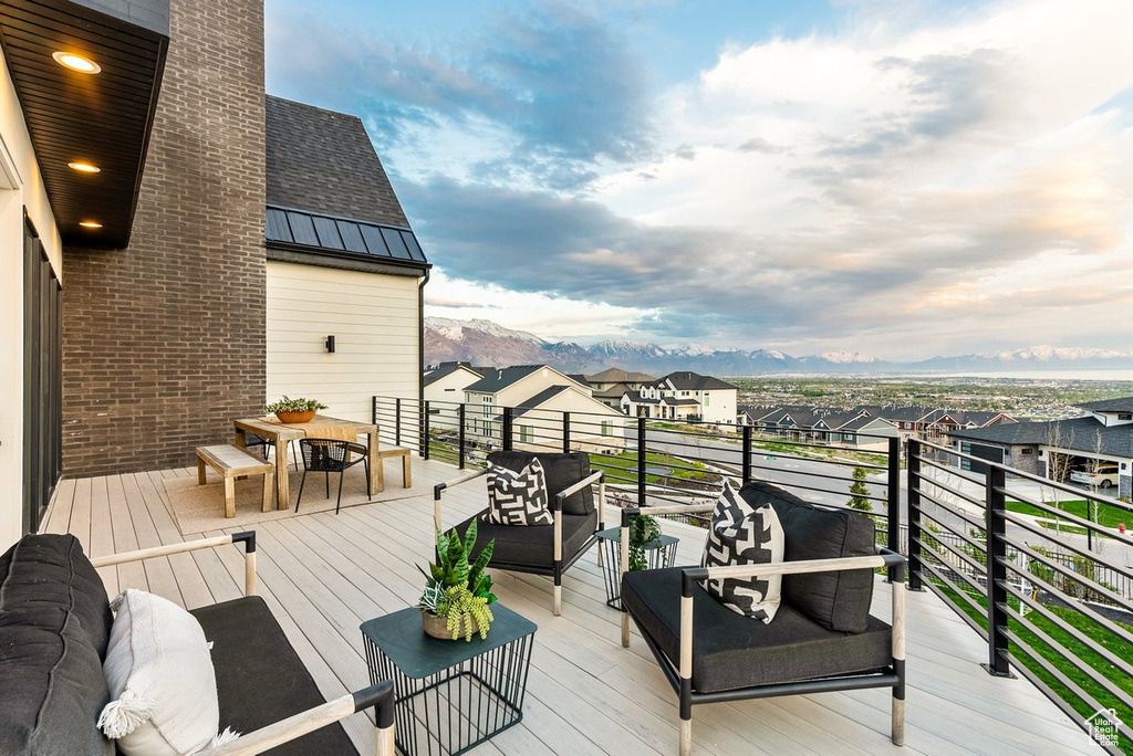 Deck with a mountain view and outdoor lounge area
