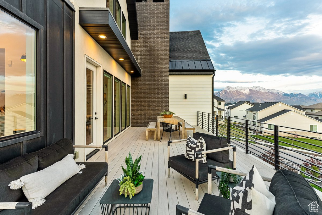 Wooden deck with a mountain view and an outdoor hangout area
