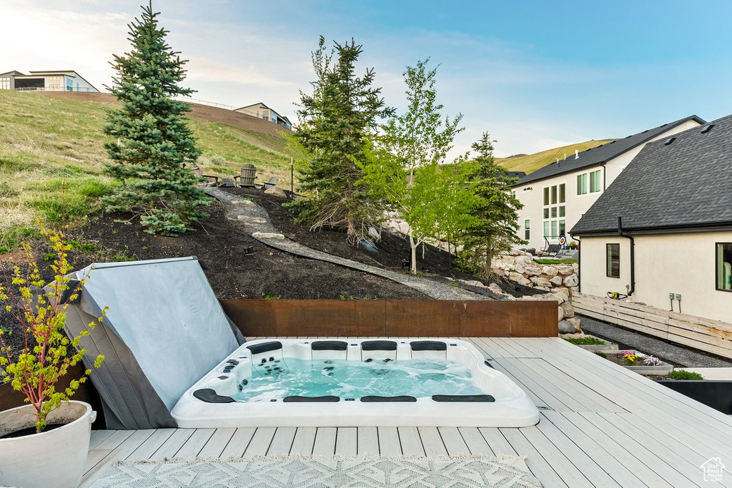Exterior space featuring a covered hot tub
