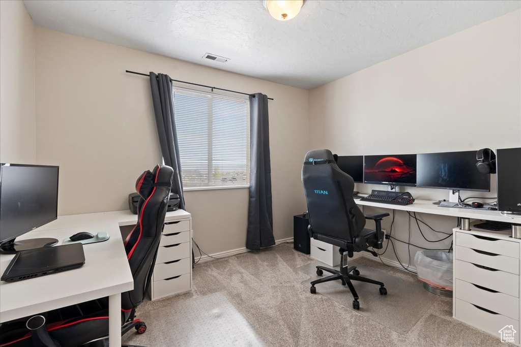 Home office featuring light carpet
